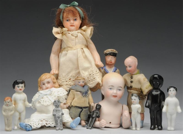 LOT OF 13: SMALL ANTIQUE DOLLS.                   