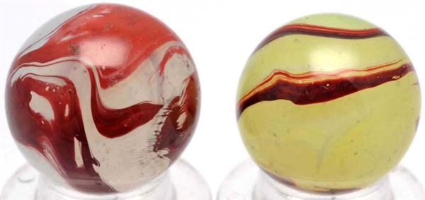 LOT OF 2: OXBLOOD MARBLES.*                       