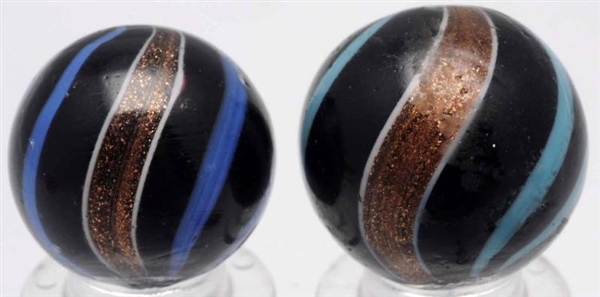 LOT OF 2: BLACK OPAQUE BANDED LUTZ MARBLES.       