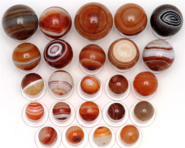 LOT OF 24: HAND FACETED AGATE MARBLES.            