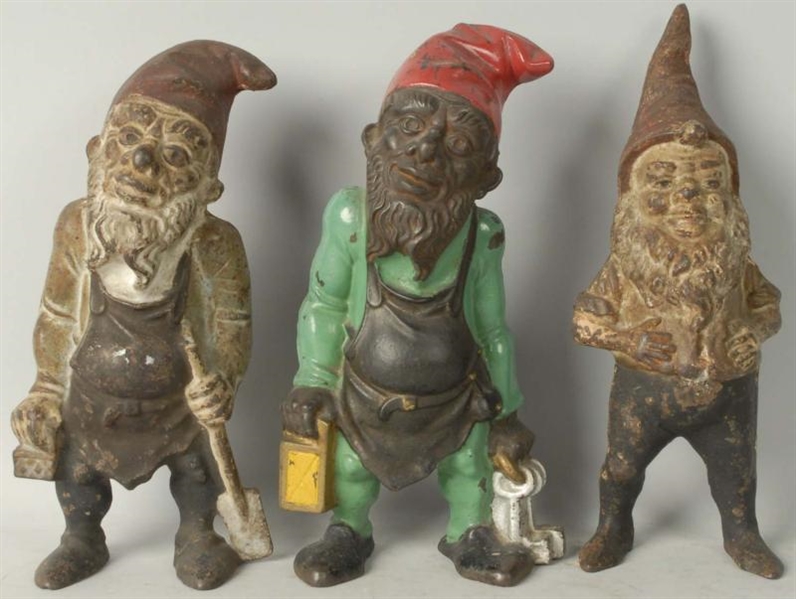 LOT OF 3: CAST IRON ASSORTED GNOME DOORSTOPS.     