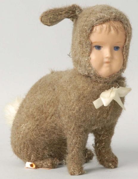 DRESSED BUNNY WITH CHILDS CELLULOID FACE.        