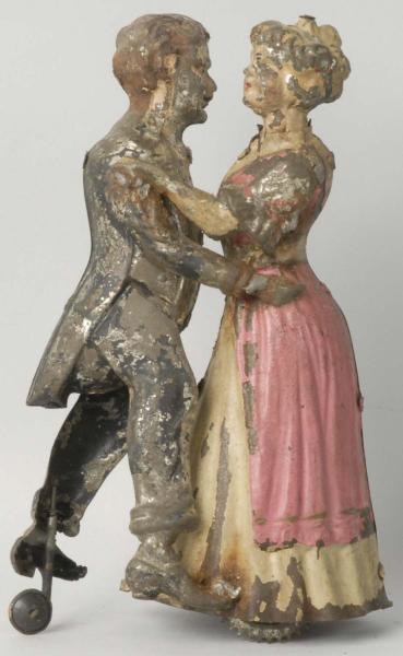 HAND-PAINTED TIN DANCING COUPLE WIND-UP TOY.      