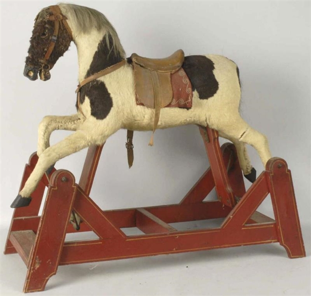 FUR-COVERED WOODEN HOBBY HORSE.                   