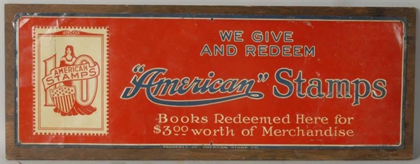 TIN "AMERICAN" STAMPS SIGN ON WOOD.               