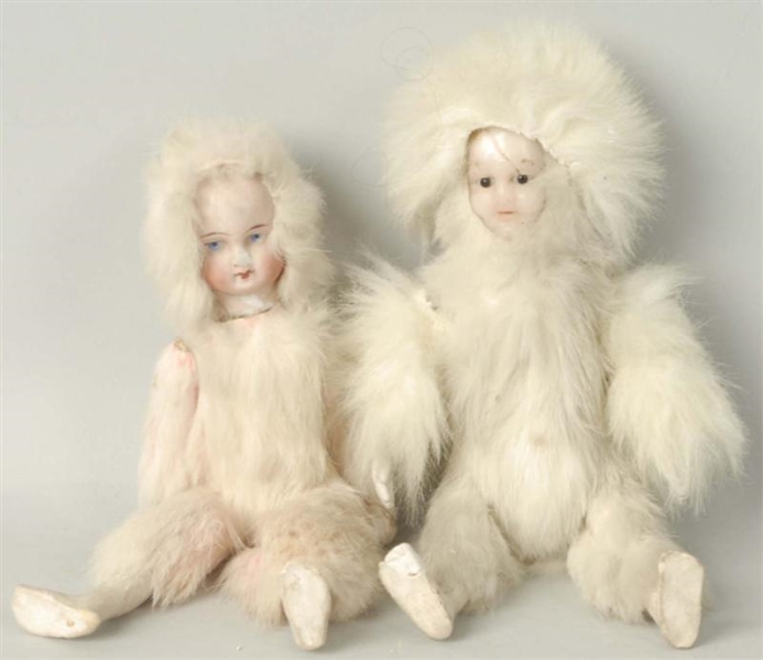 LOT OF 2: FUR COVERED DOLLS.                      