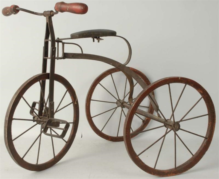CHILDS TRICYCLE WITH WOODEN & METAL WHEELS.      