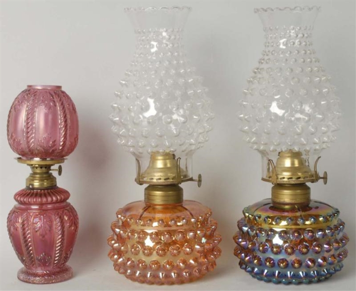 LOT OF 3: CARNIVAL GLASS TYPE OIL LAMPS.          