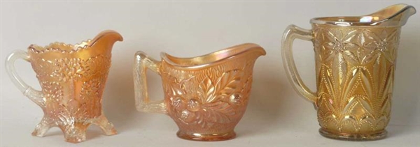 LOT OF 3: SMALL CARNIVAL GLASS PITCHERS.          