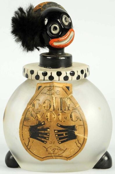 EARLY FRENCH GOLLIWOG GLASS BOTTLE.               