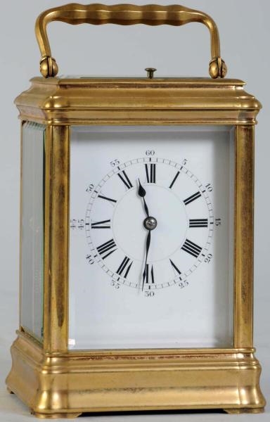 FRENCH BRASS MUSICAL CARRIAGE CLOCK.              