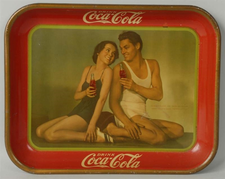 1934 COKE TRAY WITH COUPLE IN TANK TOPS.          