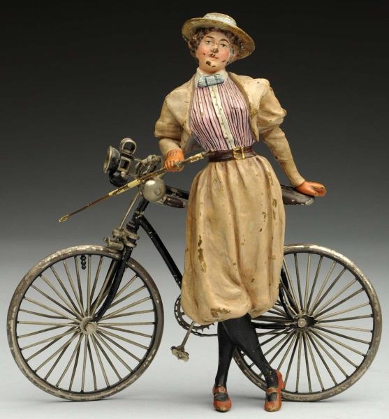 VIENNA BRONZE LADY WITH BICYCLE.                  