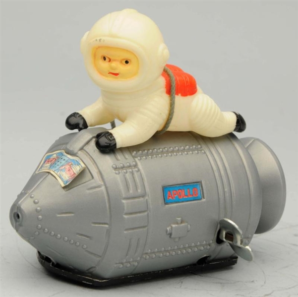 FRICTION MAN RIDING APOLLO SPACE CAPSULE.         