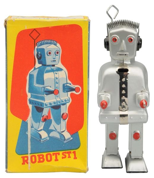 TIN PAINTED WIND-UP ROBOT ST1.                    