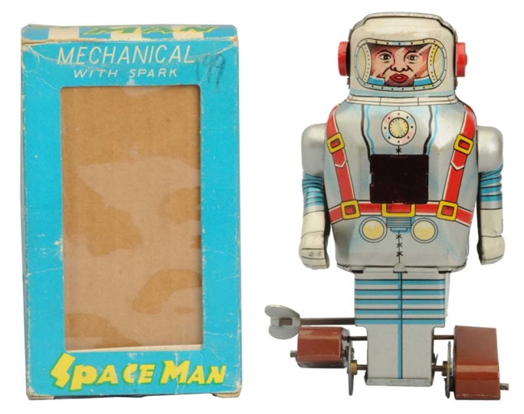 TIN LITHO WIND-UP SPACE MAN.                      