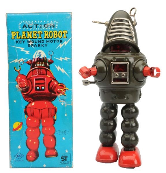 TIN PAINTED WIND-UP ACTION PLANET ROBOT.          