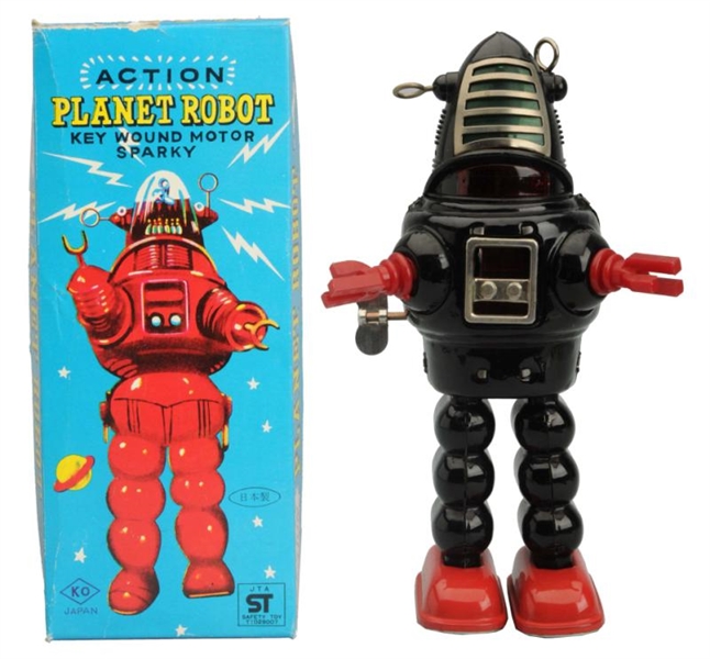 PAINTED TIN WIND-UP ACTION PLANET ROBOT.          