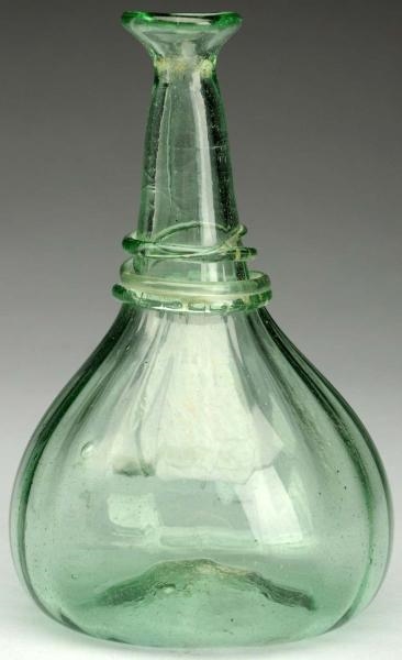 BLOWN GLASS RIBBED GREEN BOTTLE.                  
