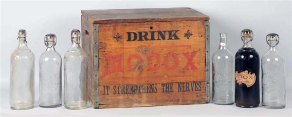 WOODEN MOXIE CRATE WITH 6 BOTTLES.                