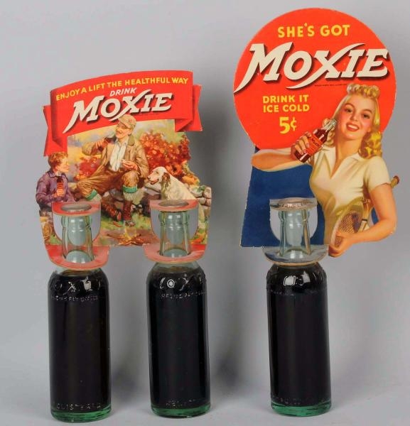 LOT OF 2: 1940S-1950S MOXIE BOTTLE TOPPERS.       