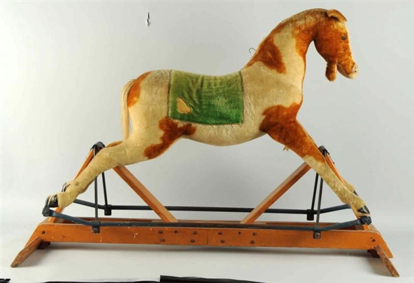 CLOTH-COVERED ROCKING HOBBY HORSE.                