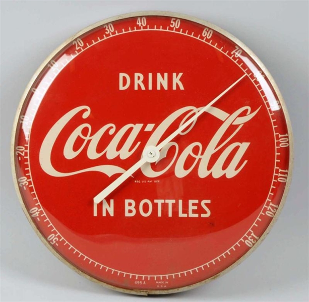 ROUND RED COKE IN BOTTLES THERMOMETER.            