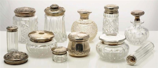 A GROUP OF SILVER AND PLATED LIDDED GLASS JARS.   