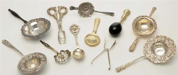 A GROUP OF SILVER AND SILVER PLATED TEA STRAINERS 