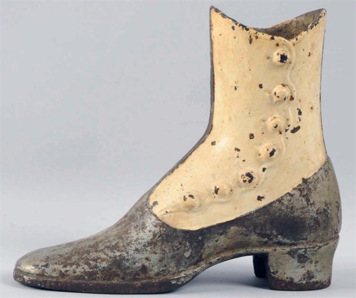 EARLY CAST IRON ADVERTISING BOOT.                 