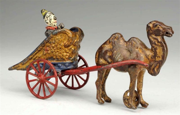 CAST IRON CAMEL-DRAWN CHARIOT TOY.                