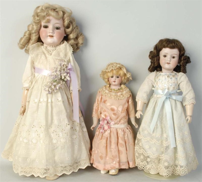 LOT OF 3: ANTIQUE BISQUE DOLLS.                   