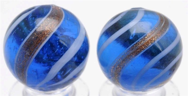 LOT OF 2: BLUE GLASS BANDED LUTZ MARBLES.         