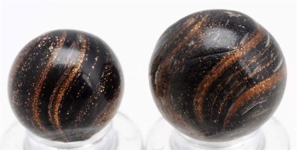 LOT OF 2: BLACK GLASS LUTZ MARBLES.               
