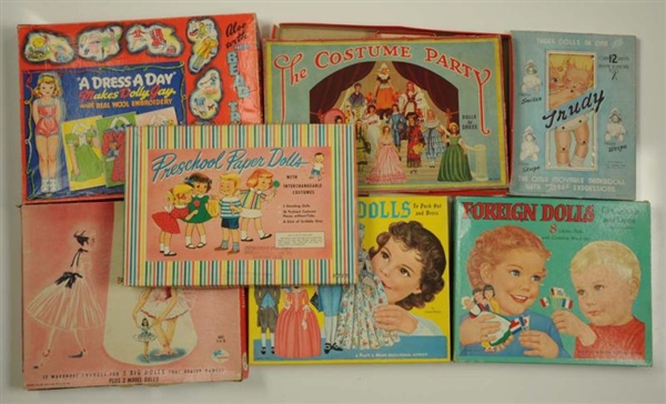 LOT OF 7: BOXED PAPER DOLLS SETS.                 