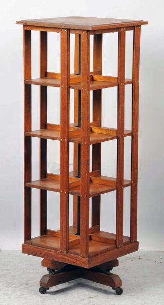 REVOLVING ARTS & CRAFTS BOOKCASE BY DANNER.       