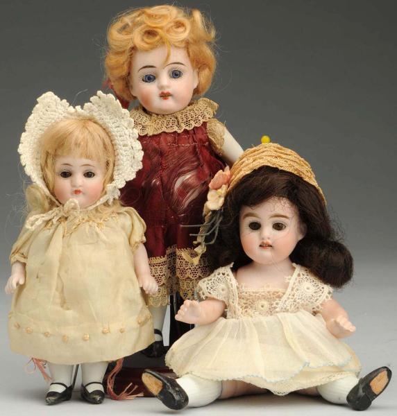LOT OF 3: ALL BISQUE DOLLS.                       