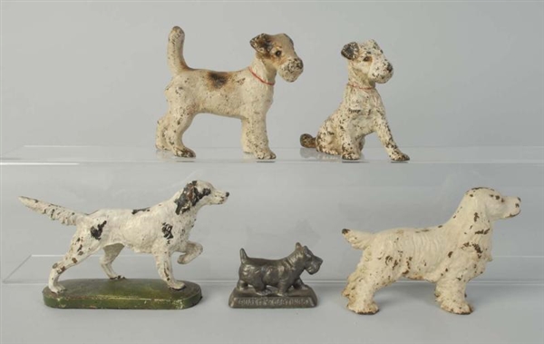 LOT OF 5: CAST IRON DOGS.                         