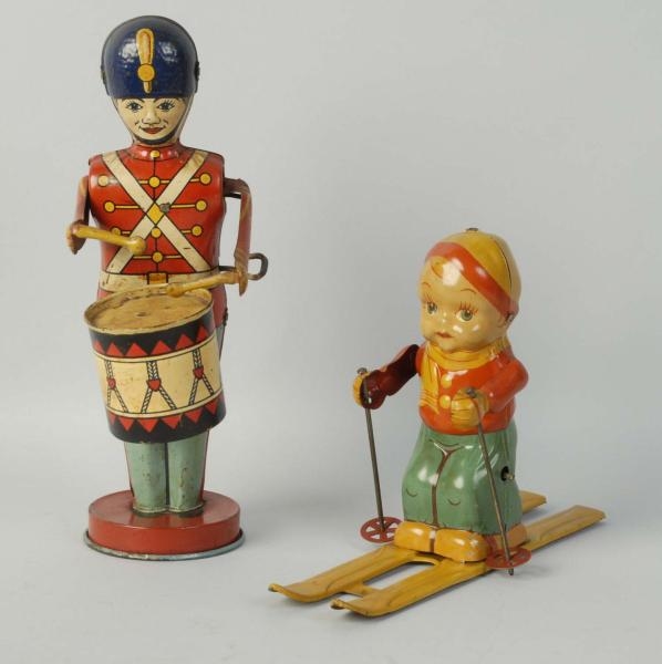 LOT OF 2: TIN WIND-UP TOYS, DRUMMER AND SKIER.    