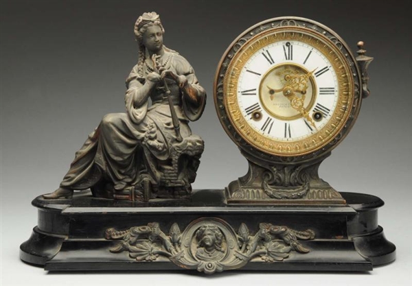 ANSONIA CLOCK WITH SEATED WOMAN.                  