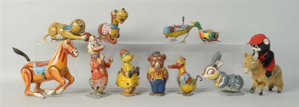 LOT OF 11: TIN & FUR COVERED LITHO WIND-UP TOYS.  
