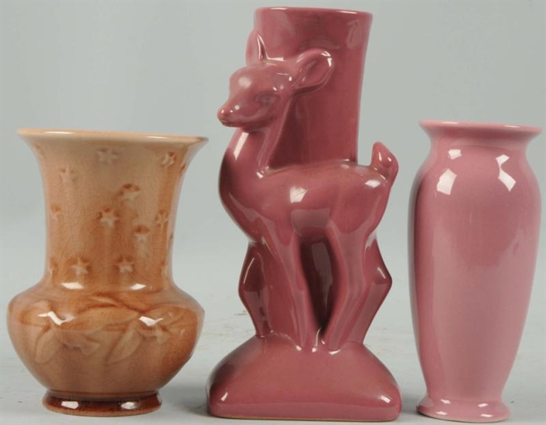 LOT OF 3: SMALL PINK POTTERY VASES.               