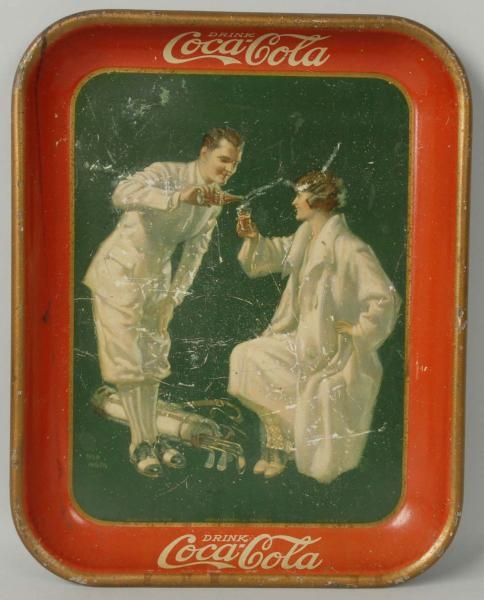 1926 COKE SERVING TRAY WITH COUPLE GOLFING.       