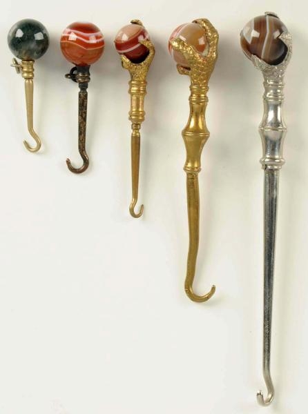 LOT OF 5: BUTTON HOOKS.                           
