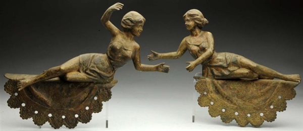 PAIR OF METAL FIGURAL LADY STAGE COACH TOPPERS.   