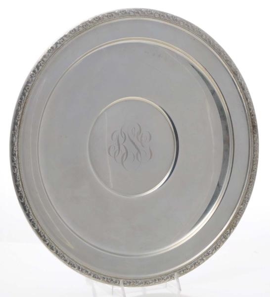 LARGE ROUND STERLING MONOGRAMMED PLATE.           