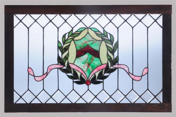 ANTIQUE STAINED GLASS WINDOW W/ WREATH.           