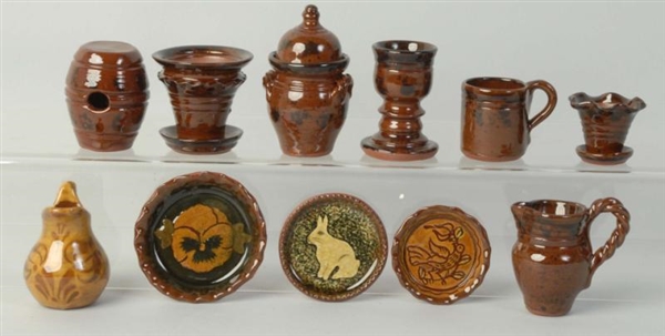 LOT OF 11: NED FOLTZ REDWARE POTTERY PIECES.      