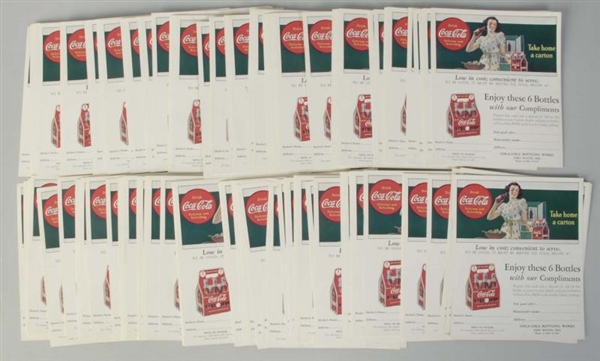STACK OF COCA-COLA COUPONS.                       