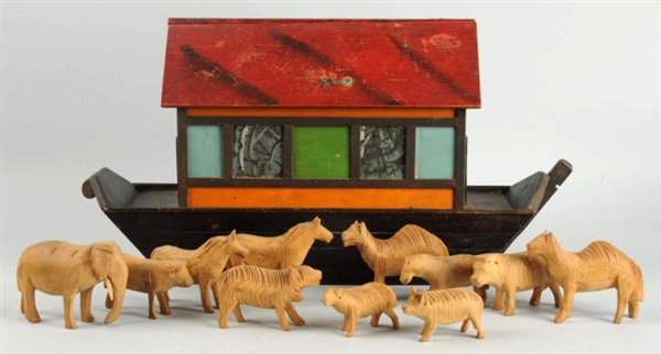 DARK WOODEN ARK WITH RED ROOF.                    